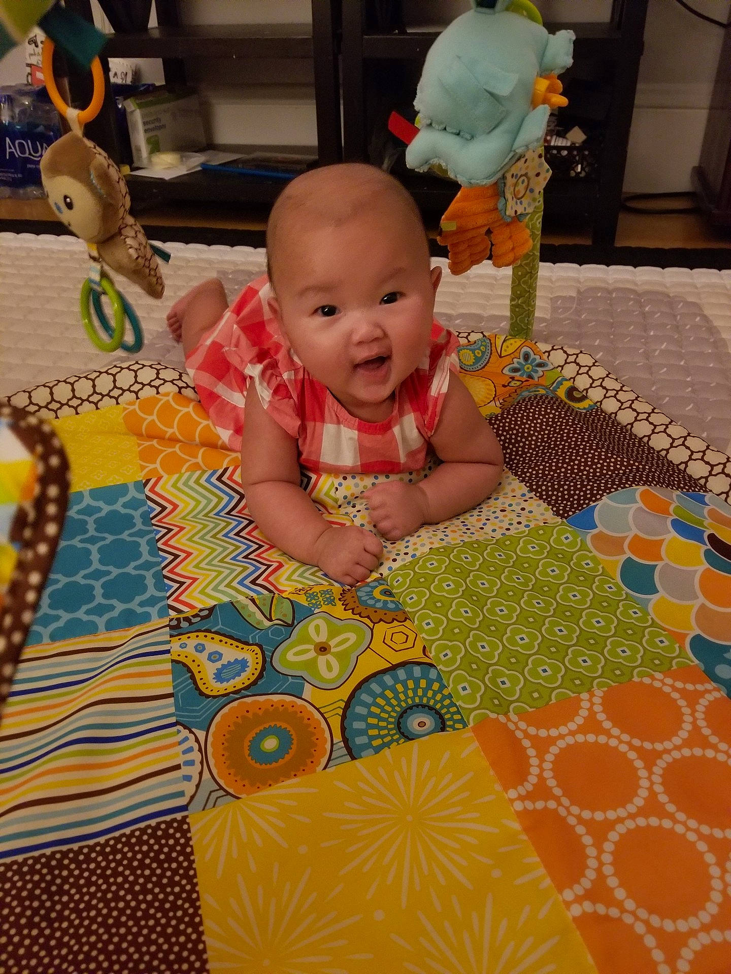 Mila joined the competition — help win amazing prizes! bedding, child, day, design, floor, flooring, fun, infant, linens, material, pattern, person, play, product, quilt, room, skin, textile, toddler, toy