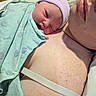 Paisley joined the competition — help win amazing prizes! newborn, baby, infant, child, parent, hospital, birth, swaddled, blanket, hat, beanie, portrait, closeup, face, sleepy, family, skin_to_skin, medical, indoors, tender