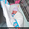 newborn, baby, infant, sleeping, swaddled, hospital, bassinet, blanket, hat, striped_hat, pacifier, pink, white, portrait, face, closed_eyes, baby_girl, hospital_room, snapchat, text_overlay