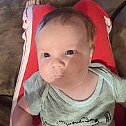 Hershel is registered to the contest to win money with this photo: baby, child, clothing, couch, cute, expression, eyes, face, furniture, hair, hand, indoors, infant, lap, mitten, onesie, person, portrait, red_pants, skin