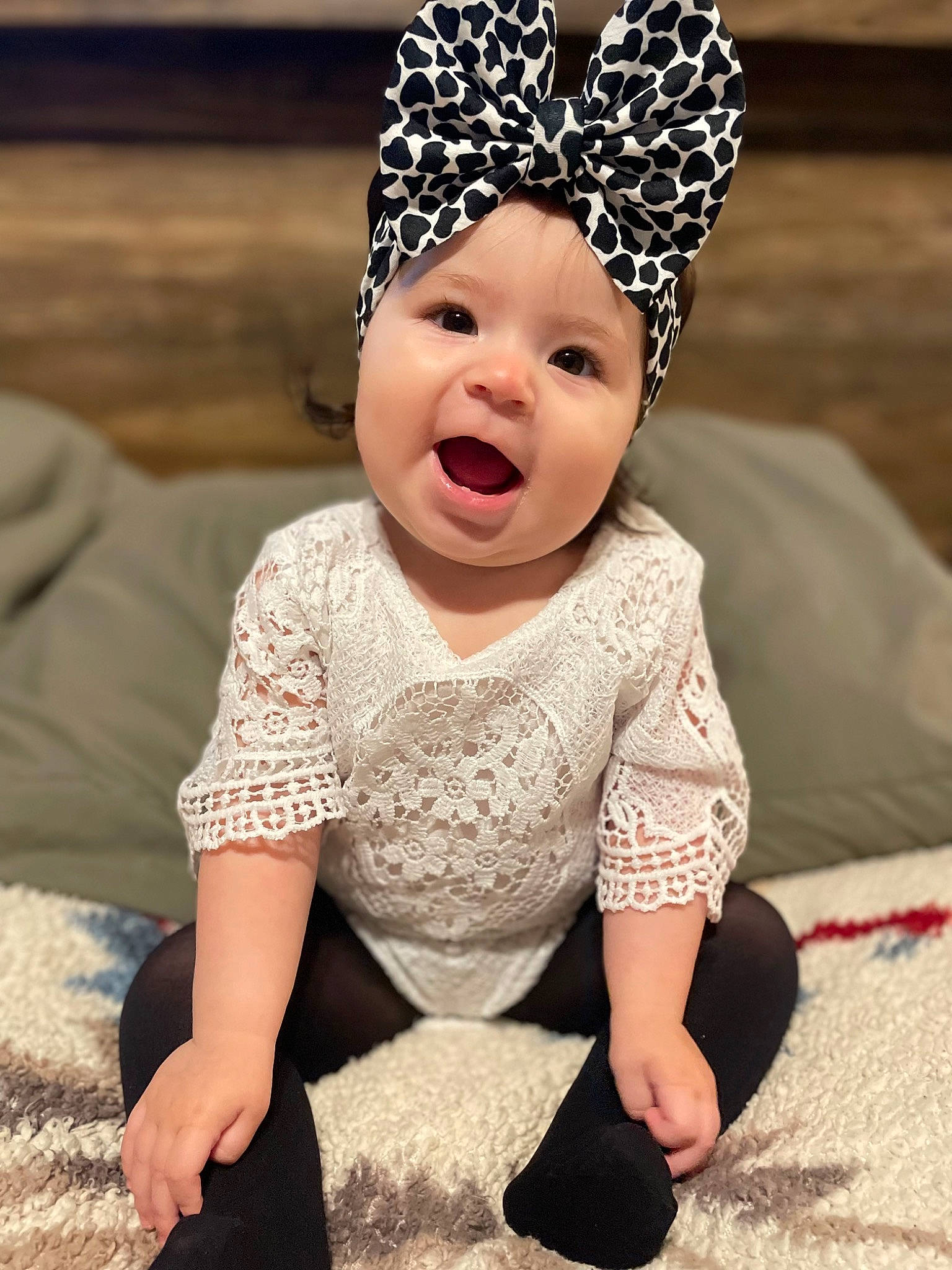 Emma joined the competition — help win amazing prizes! baby, baby_toddler_clothing, child, costume_hat, face, fashion_accessory, flooring, fun, grass, hair_accessory, happy, headband, headgear, headpiece, headwear, pattern, peach, person, pink, sleeve