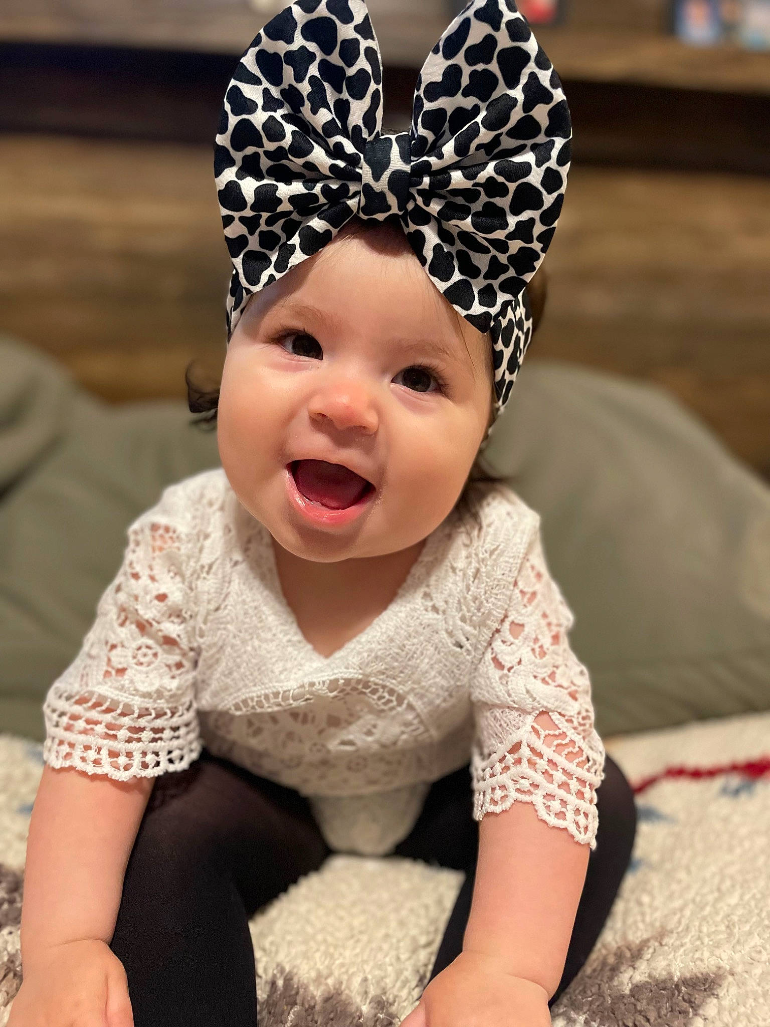 Emma is registered to the contest to win money with this photo: baby, baby_toddler_clothing, cap, child, costume_hat, crown, event, fun, gesture, happy, headband, headgear, headpiece, headwear, person, photograph, pink, skin, sleeve, smile
