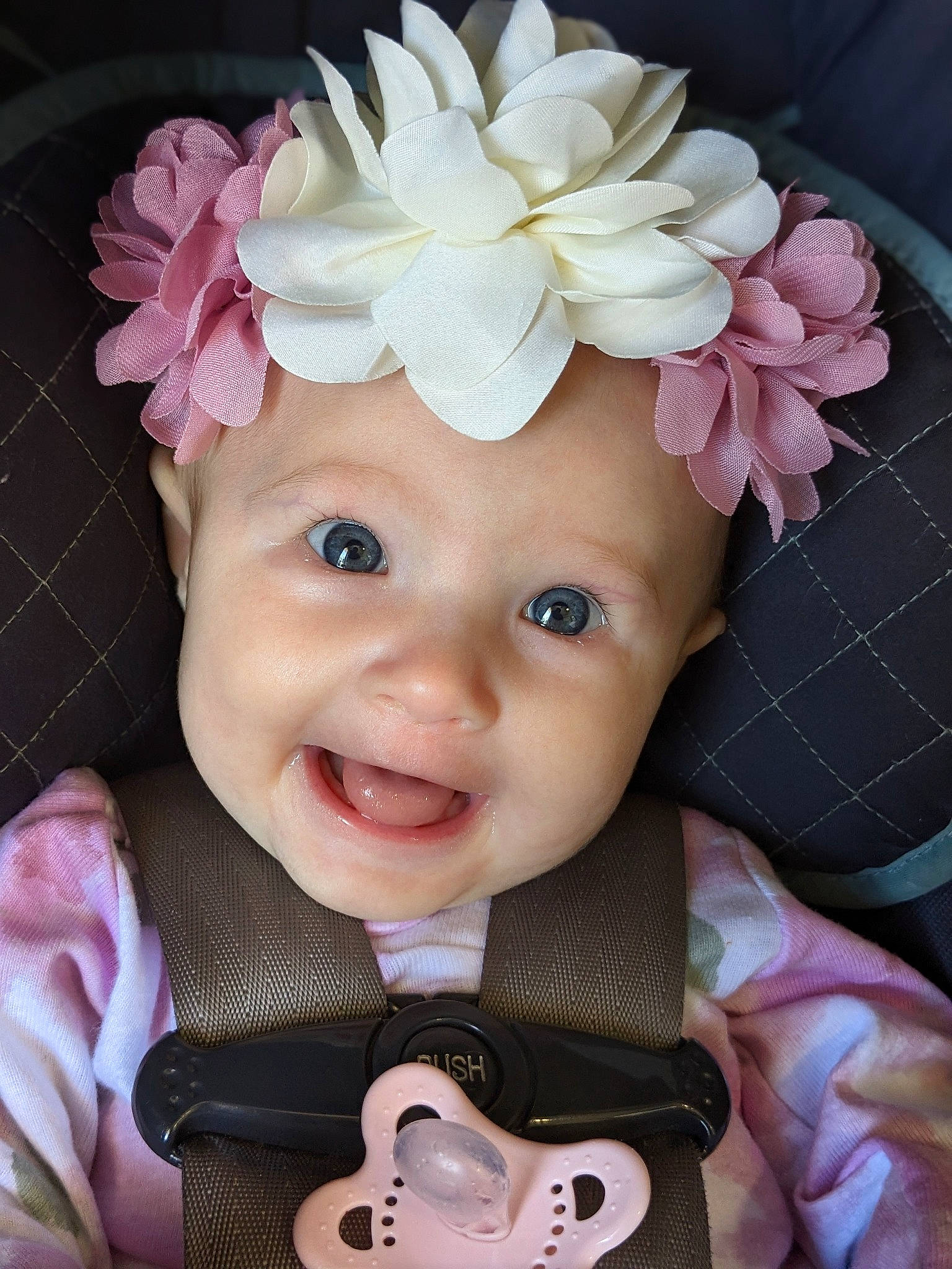 Genesis is registered to the contest to win money with this photo: baby, baby_products, baby_toddler_clothing, child, costume_hat, eye, fashion_accessory, flower, happy, hat, headband, headgear, headpiece, headwear, magenta, person, petal, pink, plant, smile