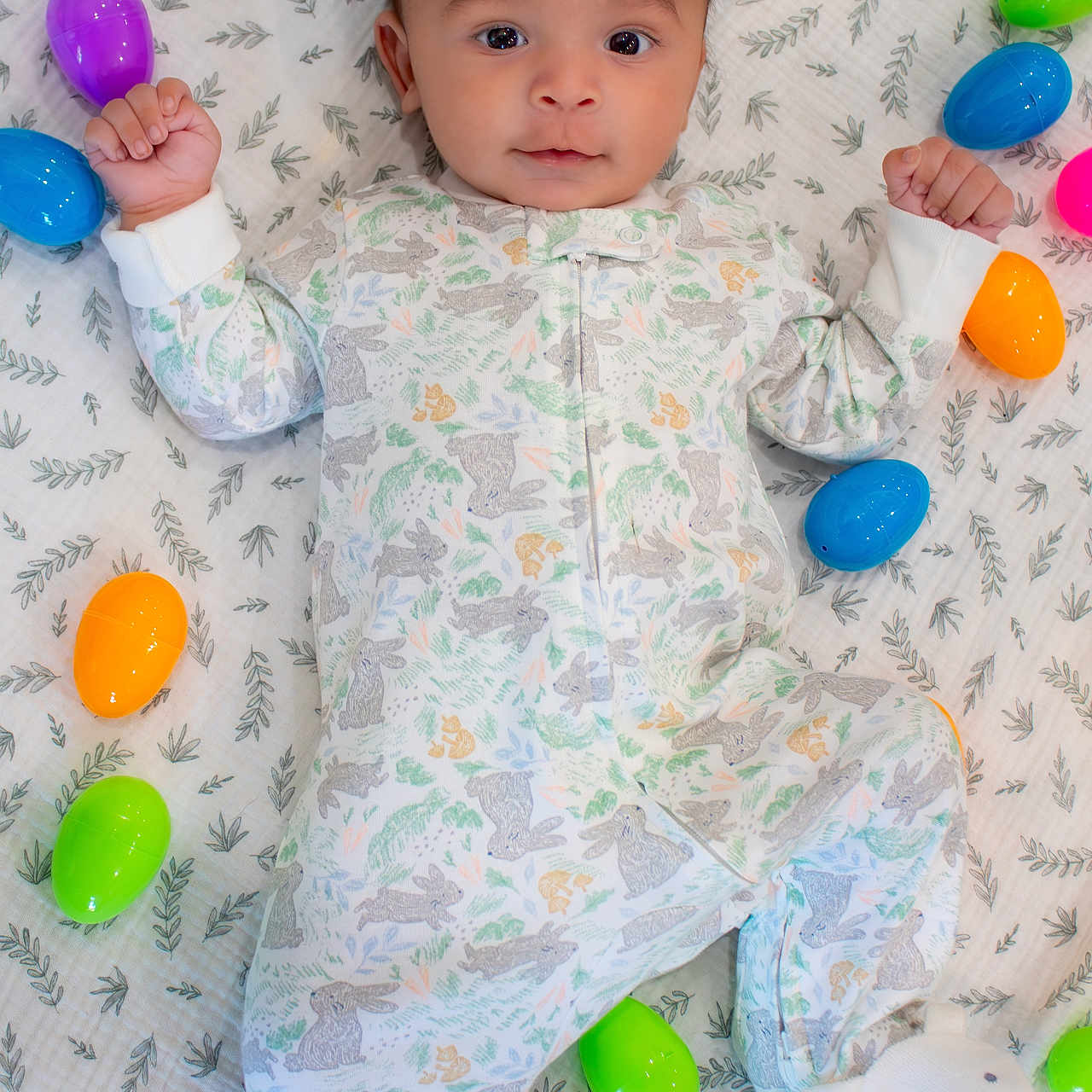 Amari joined the competition — help win amazing prizes! baby, balloon, bed, blanket, bodypart, candy, clothing, couch, face, finger, food, furniture, hand, head, pajamas, person, photography, portrait, sphere, sweets