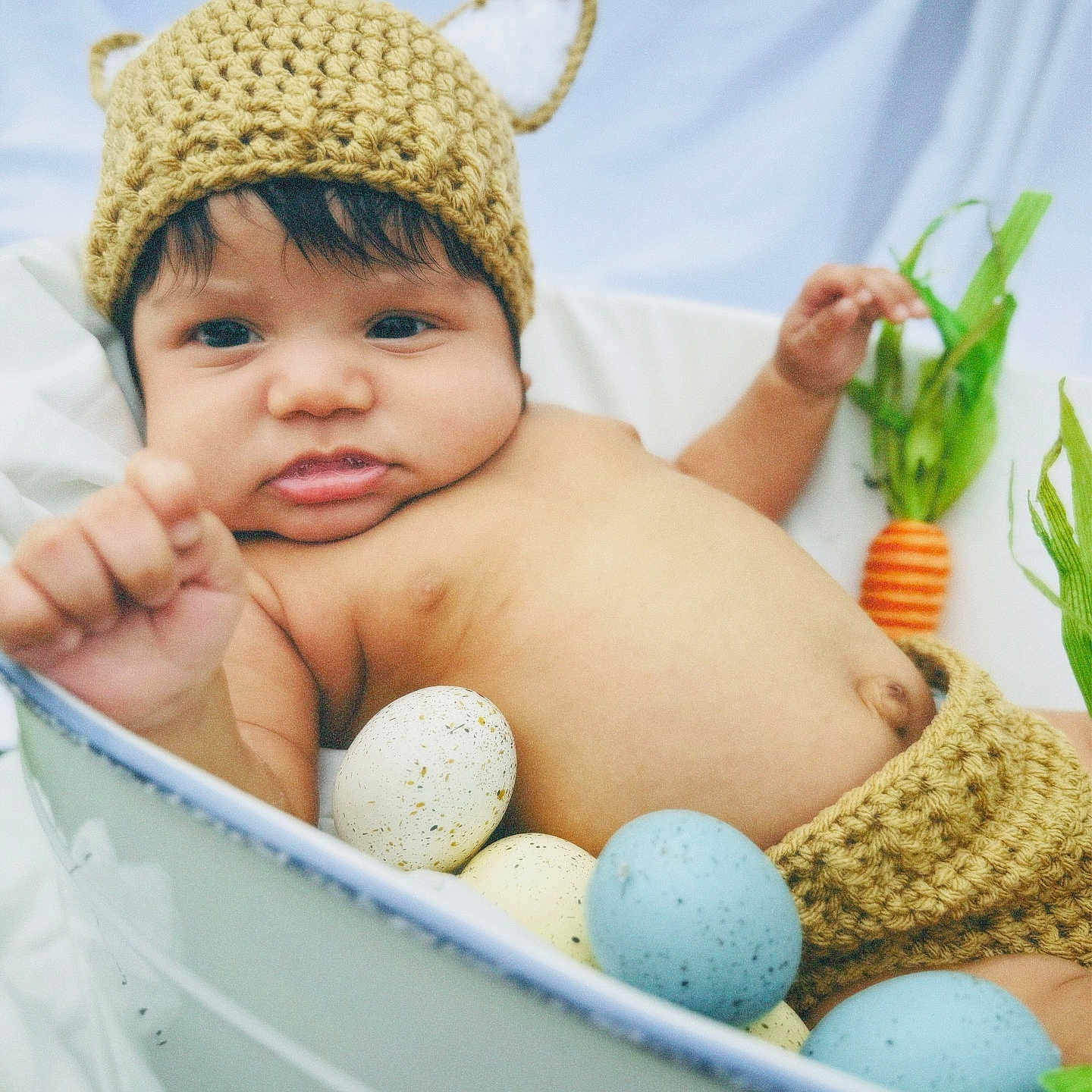 Alec is registered to the contest to win money with this photo: baby, bathing, bed, bodypart, bonnet, cap, clothing, egg, face, finger, food, hand, happy, hat, head, newborn, person, photography, portrait, smile