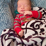 Tru'Amor joined the competition — help win amazing prizes! baby, sleeping, blanket, cozy, infant, red_striped_clothing, reindeer_design, soft_texture, peaceful, wrapped, cute, child, portrait, warm, indoors, resting, hand_near_face, head, face, newborn