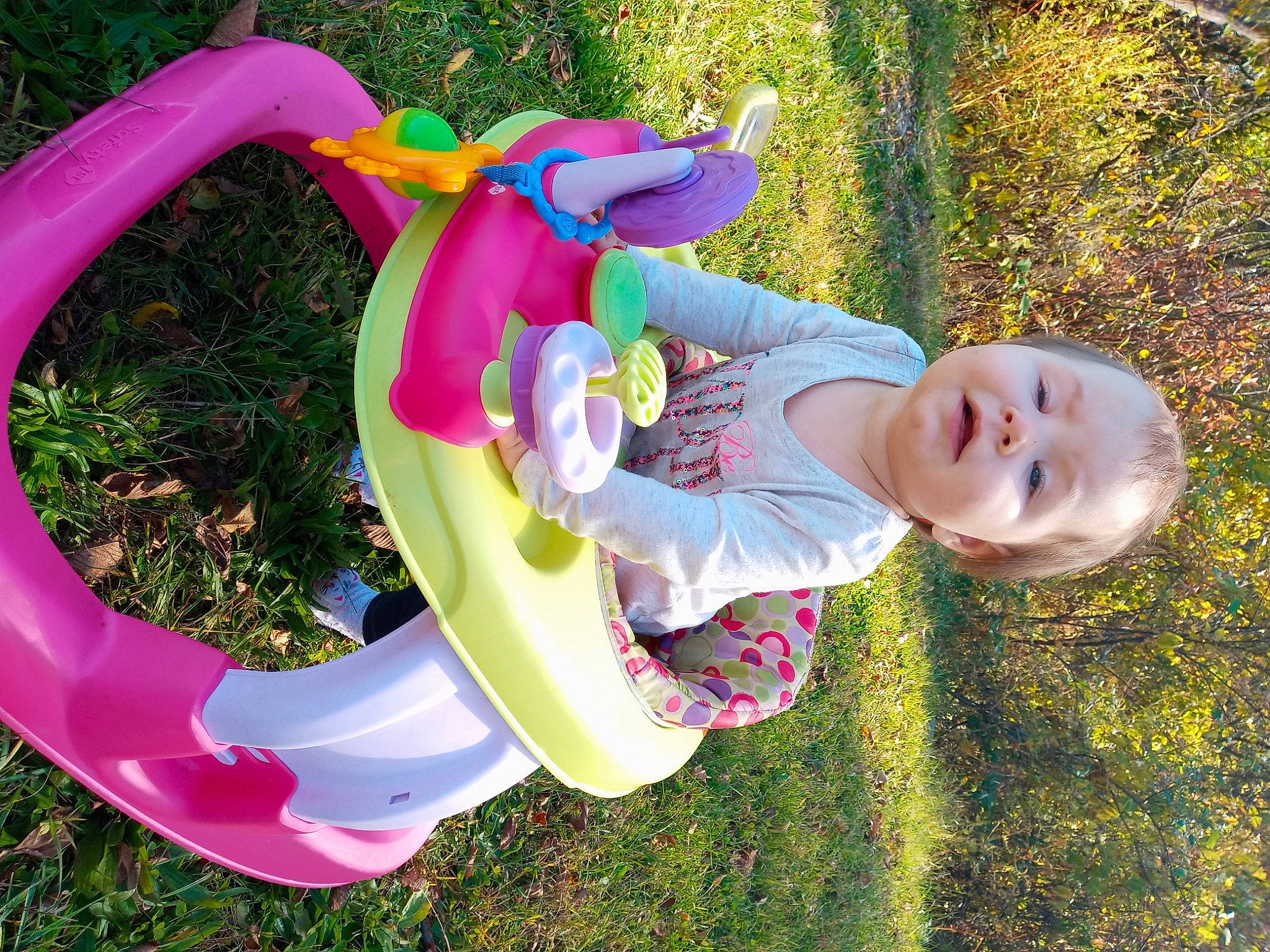 Violet is registered to the contest to win money with this photo: baby, child, fun, outdoor_play_equipment, person, pink, play, playground, public_space, recreation, toddler