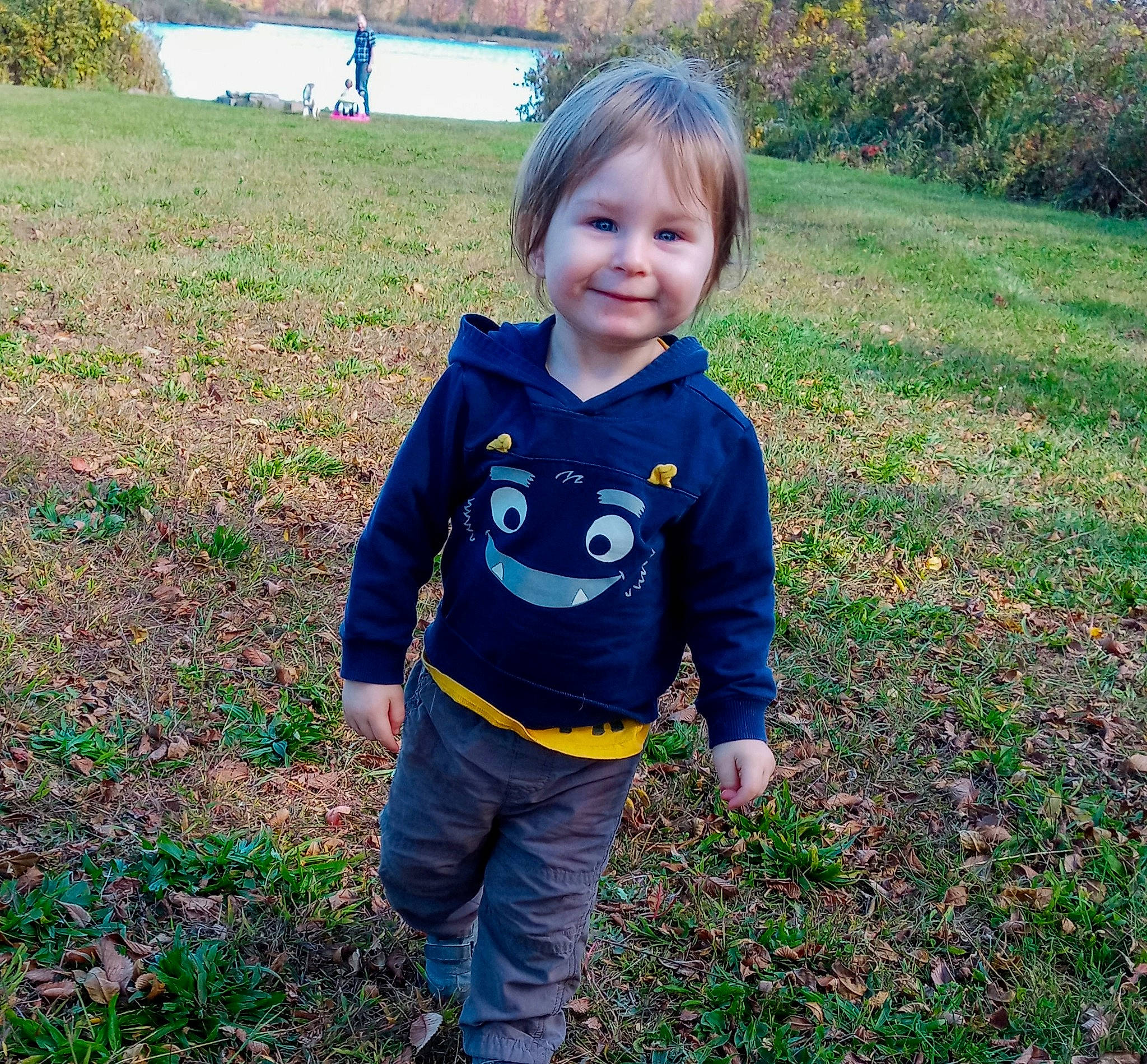 Franklin is registered to the contest to win money with this photo: child, grass, jacket, joy, leaf, mountain, outerwear, person, plant, play, sleeve, smile, t_shirt, toddler, tree