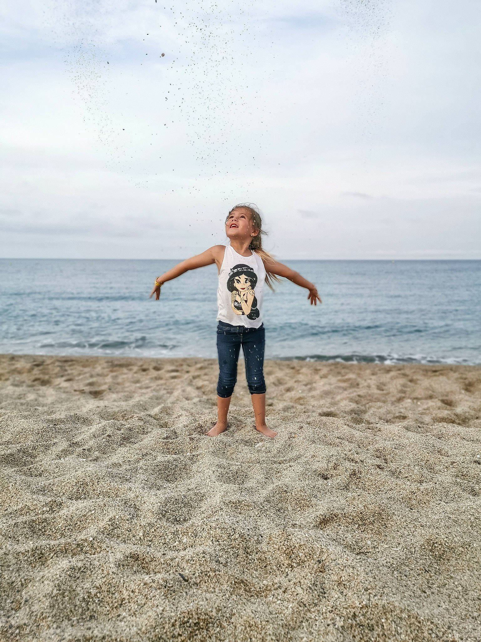 Mila participe au concours pour gagner de l'argent avec cette photo : barefoot, beach, coast, fun, happy, horizon, jumping, leg, ocean, person, photograph, photography, sand, sea, shore, sky, standing, summer, vacation, water