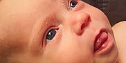 Kingsley is registered to the contest to win money with this photo: baby, infant, face, skin, blue_eyes, tongue, close_up, curious, child, portrait, head, ear, soft_light, expression, human, newborn, cute, resting, indoors, person