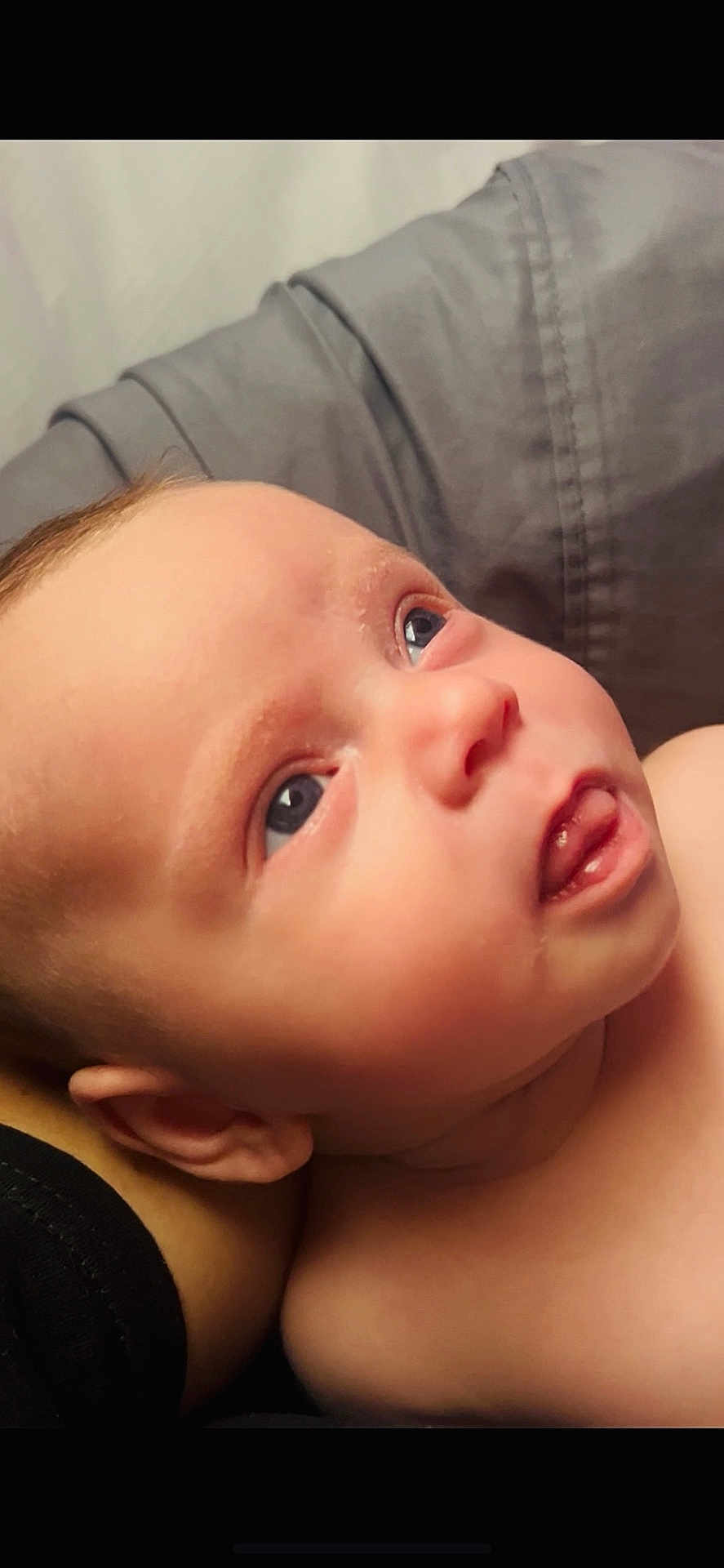 Kingsley is registered to the contest to win money with this photo: baby, infant, face, skin, blue_eyes, tongue, close_up, curious, child, portrait, head, ear, soft_light, expression, human, newborn, cute, resting, indoors, person