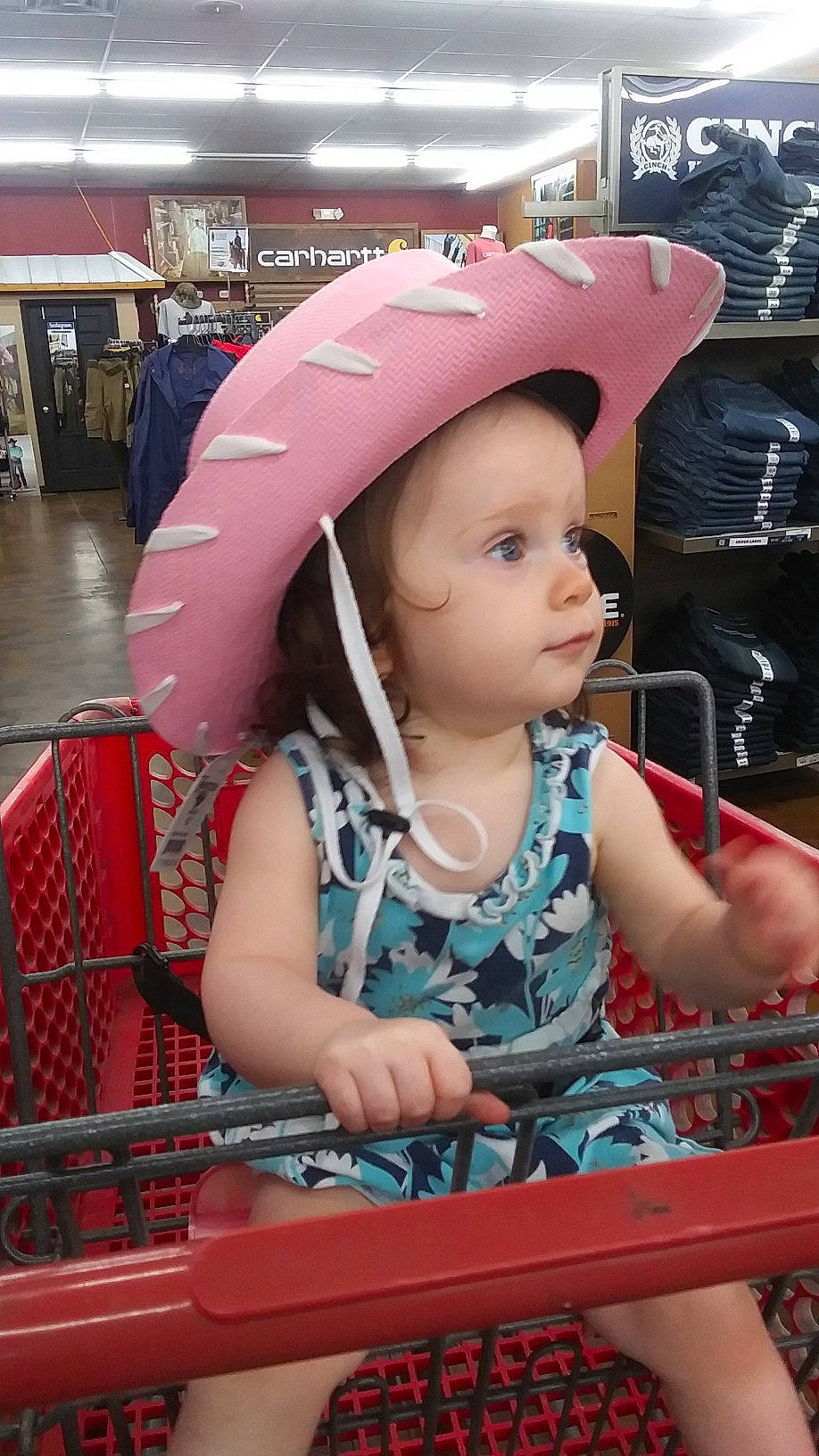 Kimberly Ward is registered to the contest to win money with this photo: automotive_design, baby_carriage, baby_toddler_clothing, baseball_cap, cap, child, fashion_accessory, fun, headwear, helmet, leisure, magenta, motor_vehicle, person, personal_protective_equipment, pink, product, public_space, sitting, skin