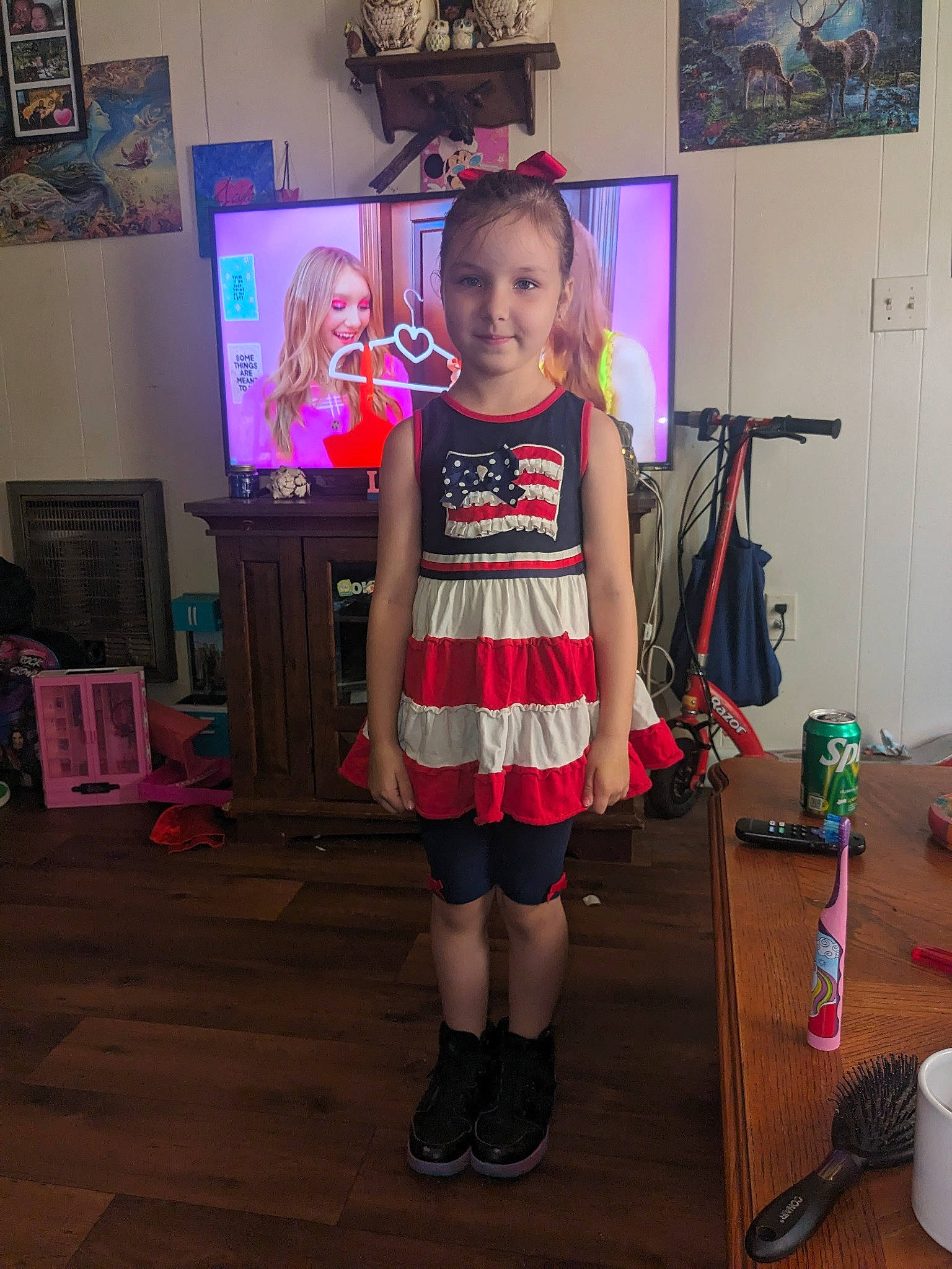 Jayla is registered to the contest to win money with this photo: art, chair, child, costume, entertainment, event, fashion_design, fictional_character, flooring, fun, joy, party, person, picture_frame, room, sandal, shoe, smile, sportswear, t_shirt