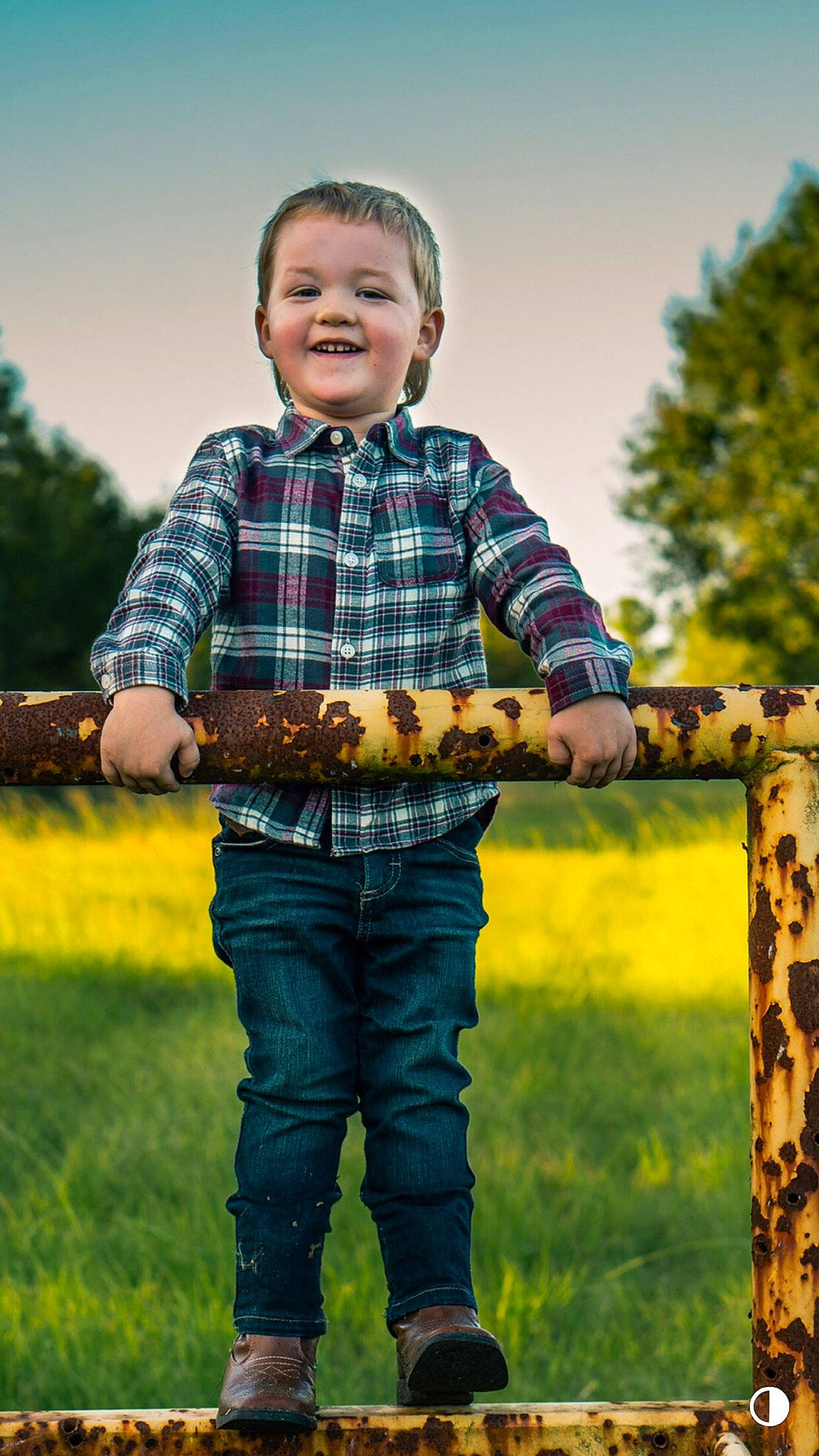 Greyson is registered to the contest to win money with this photo: cool, denim, flash_photography, fun, grass, grassland, happy, joy, pattern, people_in_nature, person, plaid, plant, recreation, sky, sleeve, smile, t_shirt, tartan, toddler