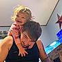 toddler, man, child, smiling, happy, indoor, tank, aquarium, tattoo, black_shirt, star_decoration, playful, family, bonding, casual, hair, hand, face, person, room