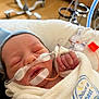 Weston joined the competition — help win amazing prizes! newborn, baby, hospital, medical_tubes, blanket, sleeping, infant, face, hand, clothing, nasal_cannula, medical_tape, bed, healthcare, person, cute, resting, closeup, pediatric, soft