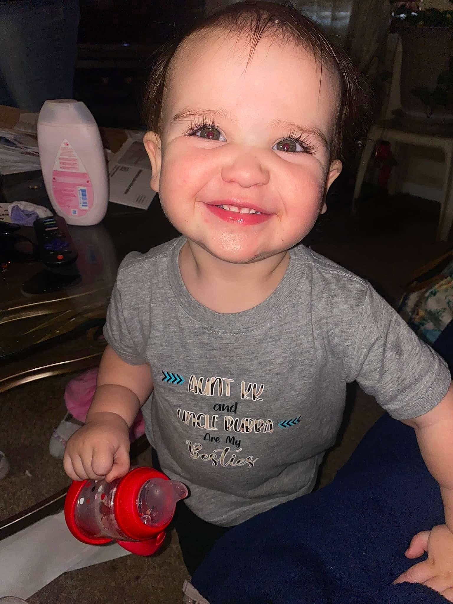 Alexandria is registered to the contest to win money with this photo: baby, baby_toddler_clothing, cheek, child, cool, drinkware, finger, fun, gas, hairstyle, happy, joy, nose, person, sitting, skin, sleeve, smile, t_shirt, thumb