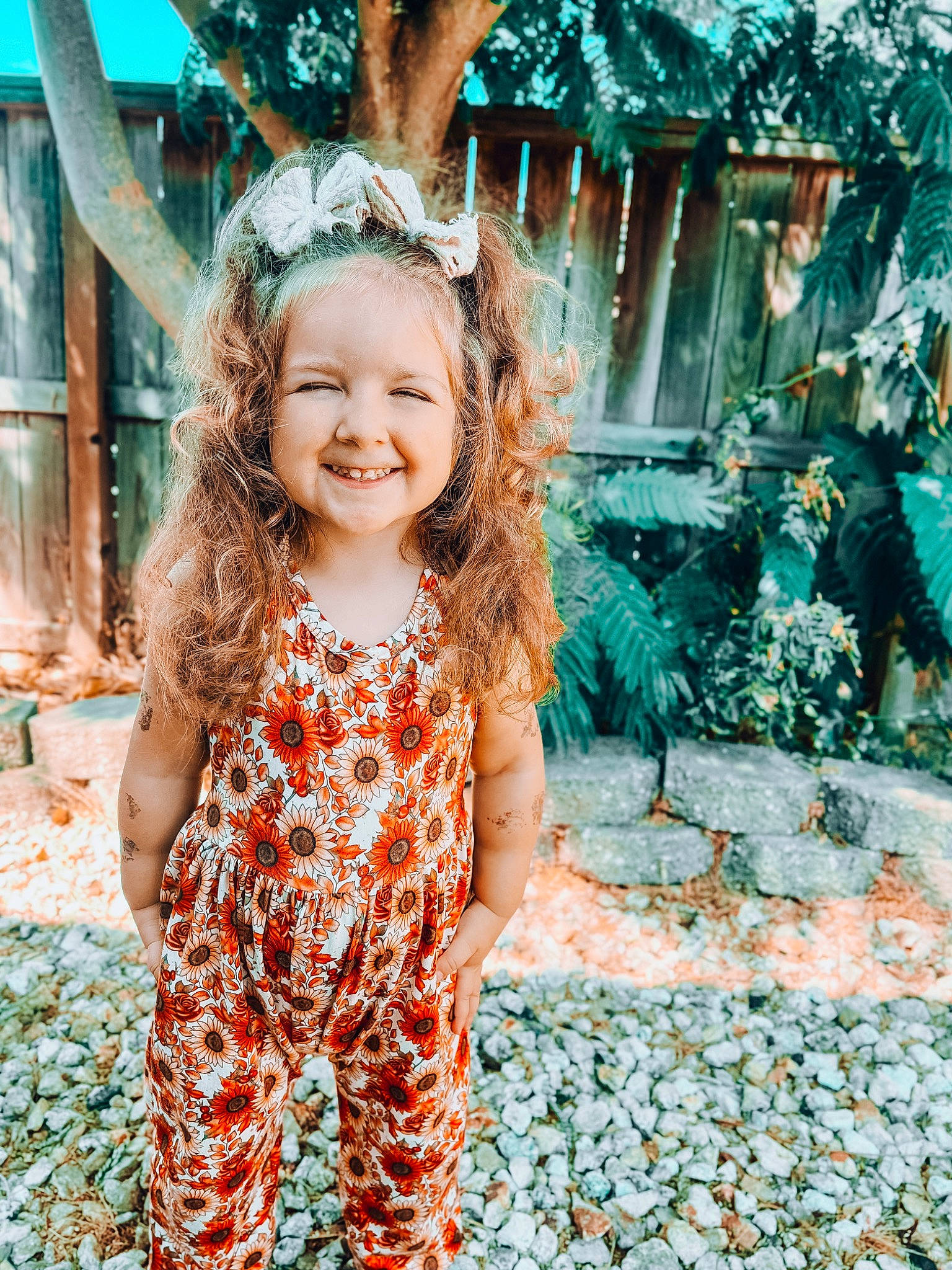 Everly is registered to the contest to win money with this photo: baby_toddler_clothing, blond, child, fashion_accessory, fun, grass, green, happy, headpiece, joy, laugh, leaf, leisure, pattern, people_in_nature, person, portrait_photography, smile, toddler, tree