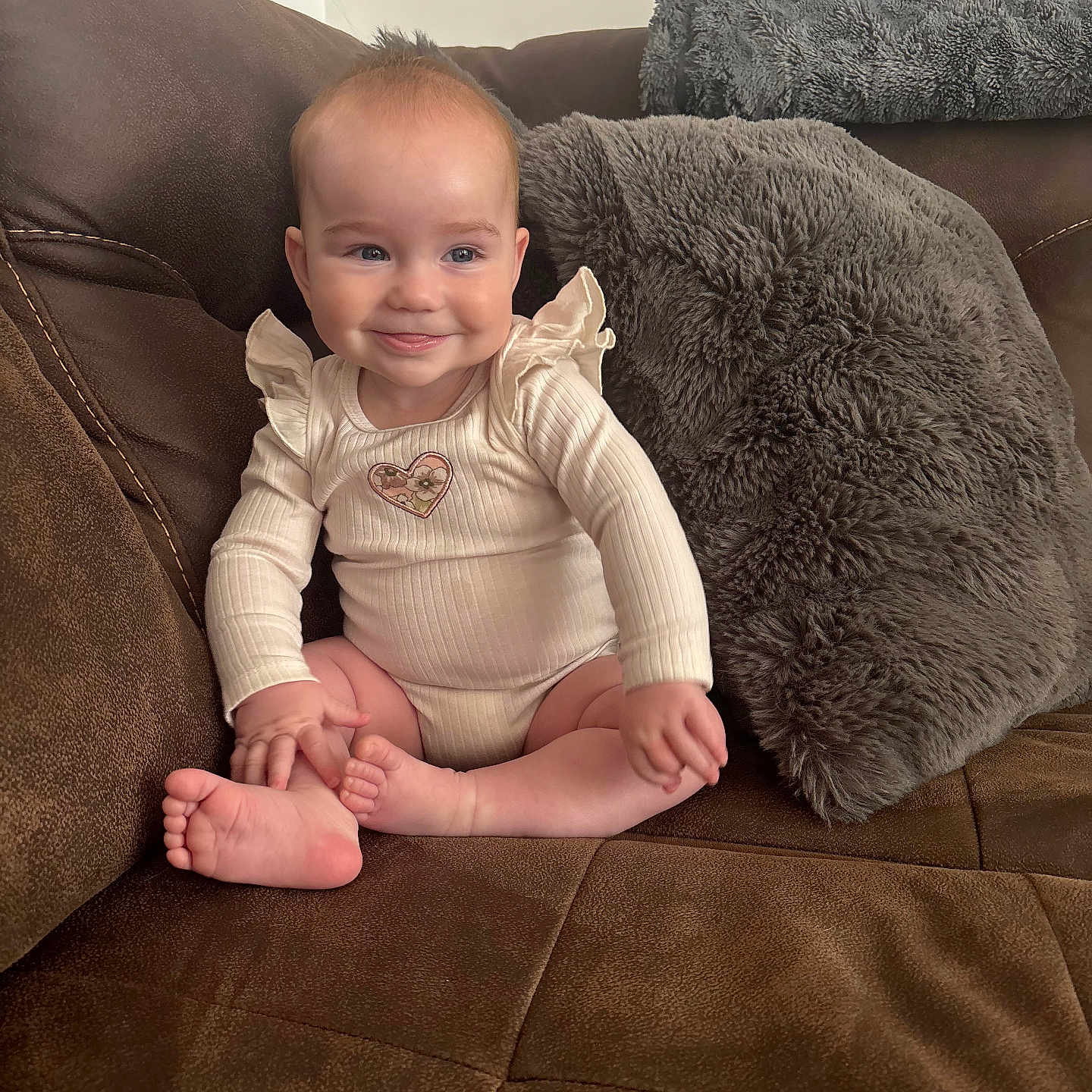 Ava joined the competition — help win amazing prizes! baby, bodypart, chair, clothing, couch, cushion, face, finger, furniture, hand, happy, head, homedecor, indoors, pants, person, photography, portrait, sitting, smile