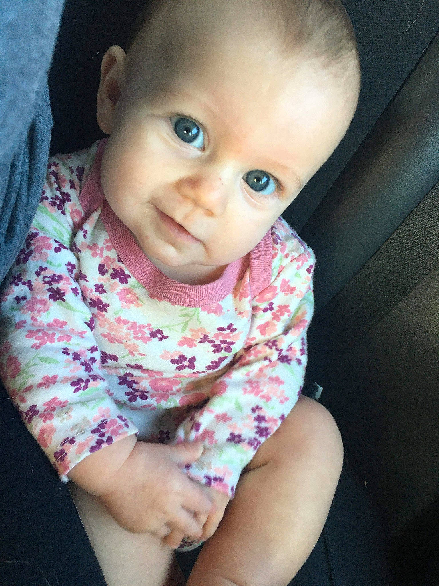 Lucille is registered to the contest to win money with this photo: baby, beauty, cheek, child, chin, cool, eye, eyebrow, face, forehead, hair, head, iris, lip, nose, person, pink, sitting, skin, smile