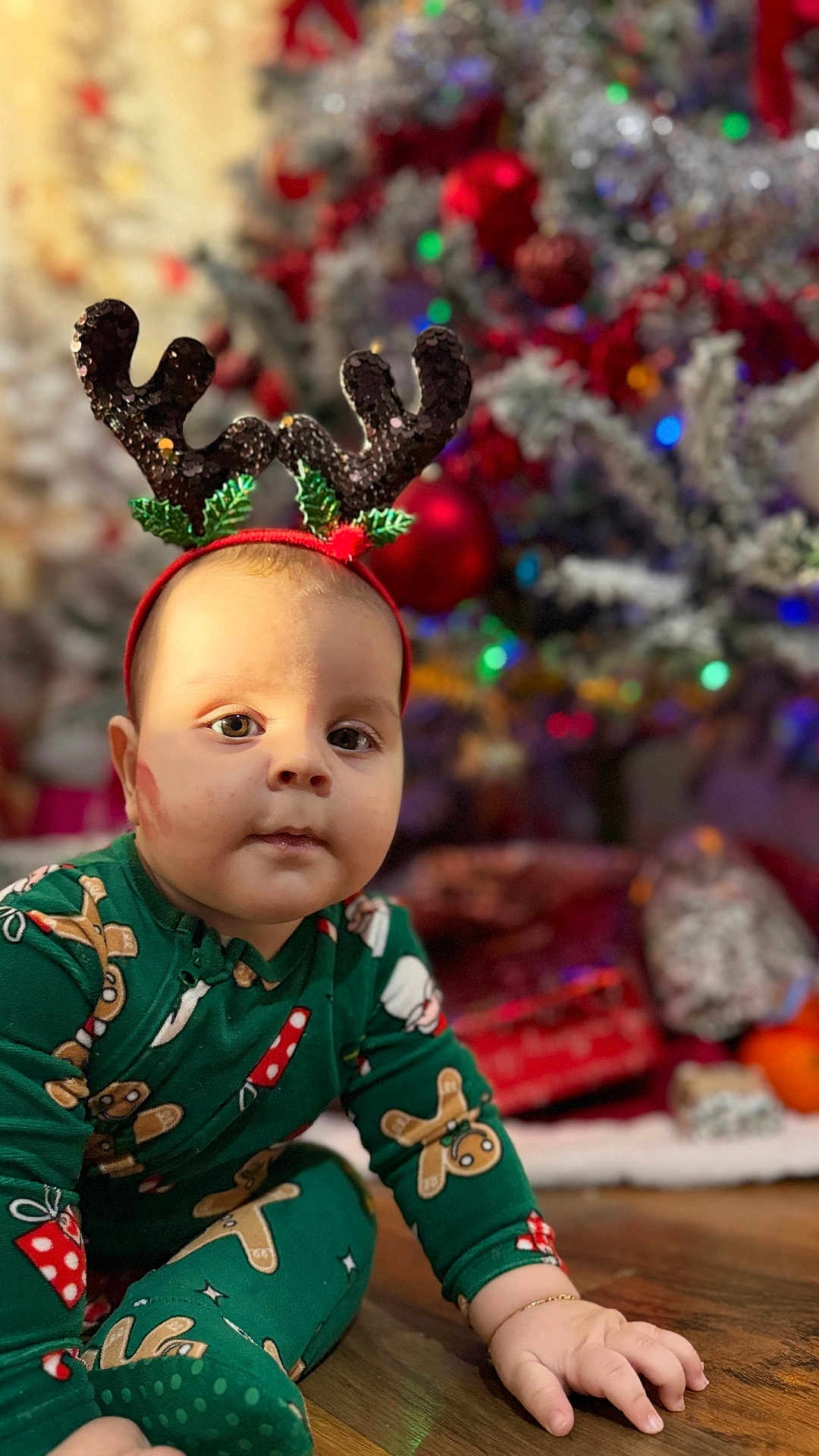 Matteo joined the competition — help win amazing prizes! baby, child, reindeer_antlers, christmas_tree, christmas_pajamas, gingerbread_man, candy_cane, holiday, festive, pajamas, floor, wooden_floor, present, gift_wrap, decorations, indoor, holiday_season, cute, portrait, seasonal