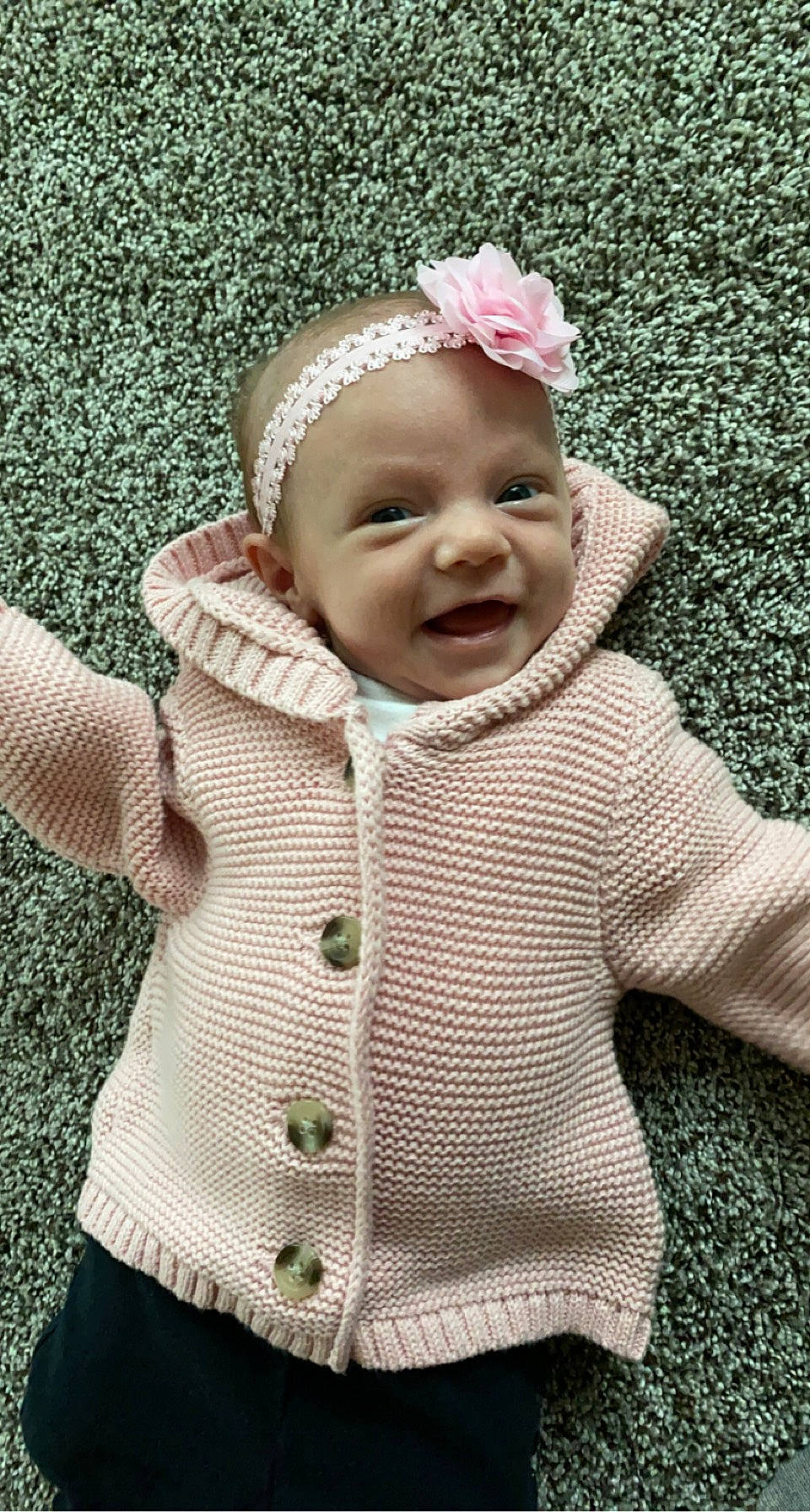 Karissa is registered to the contest to win money with this photo: baby, baby_toddler_clothing, cap, child, dress, eye, grass, happy, headgear, jacket, lip, outerwear, pattern, person, pink, product, skin, sleeve, smile, textile