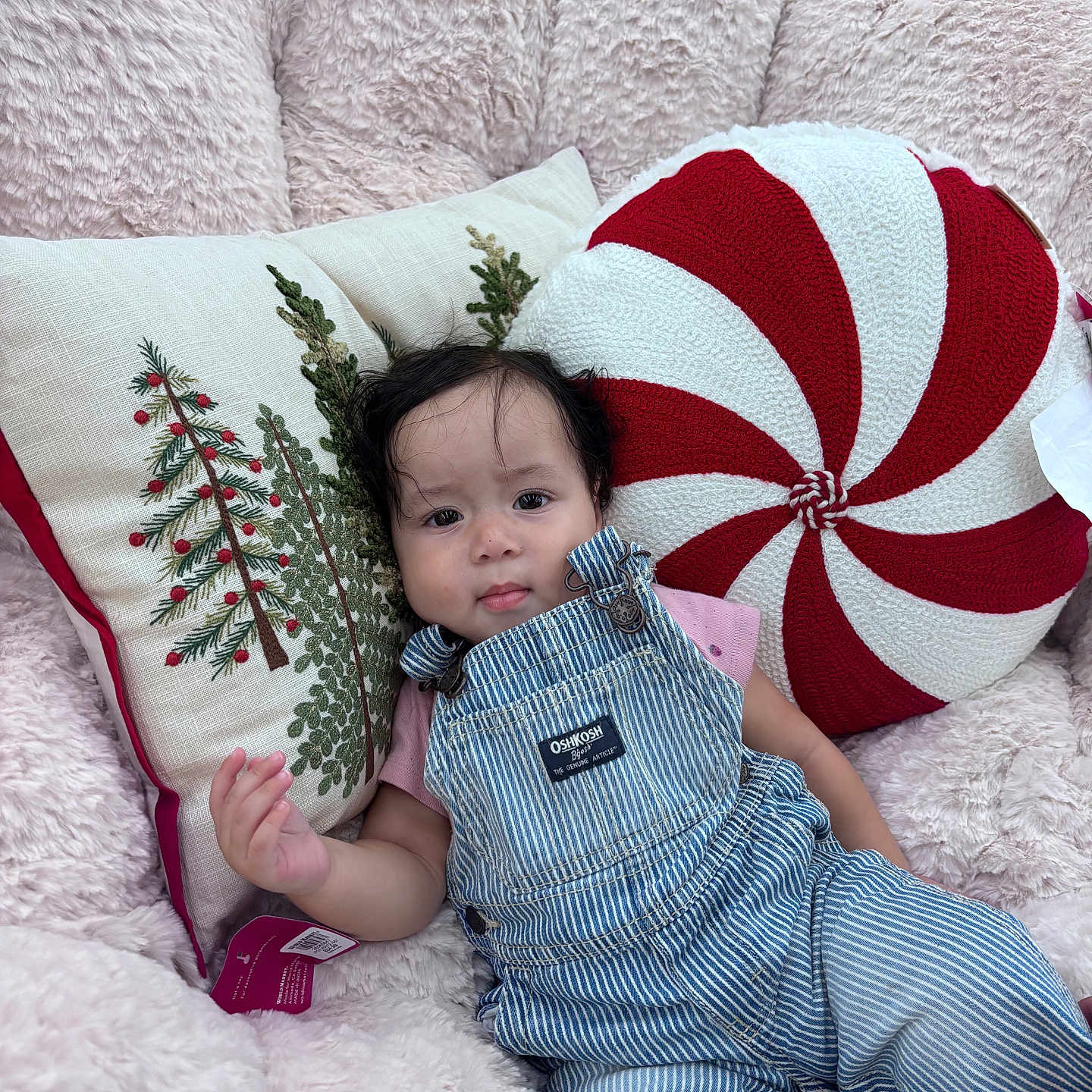 Liliana joined the competition — help win amazing prizes! baby, child, christmas_pillow, cute, embroidered_pillow, fluffy_chair, holiday_theme, indoor, infant, overalls, peppermint_pillow, person, pillows, pink_shirt, portrait, relaxed, seated, soft_texture, striped_clothing, young