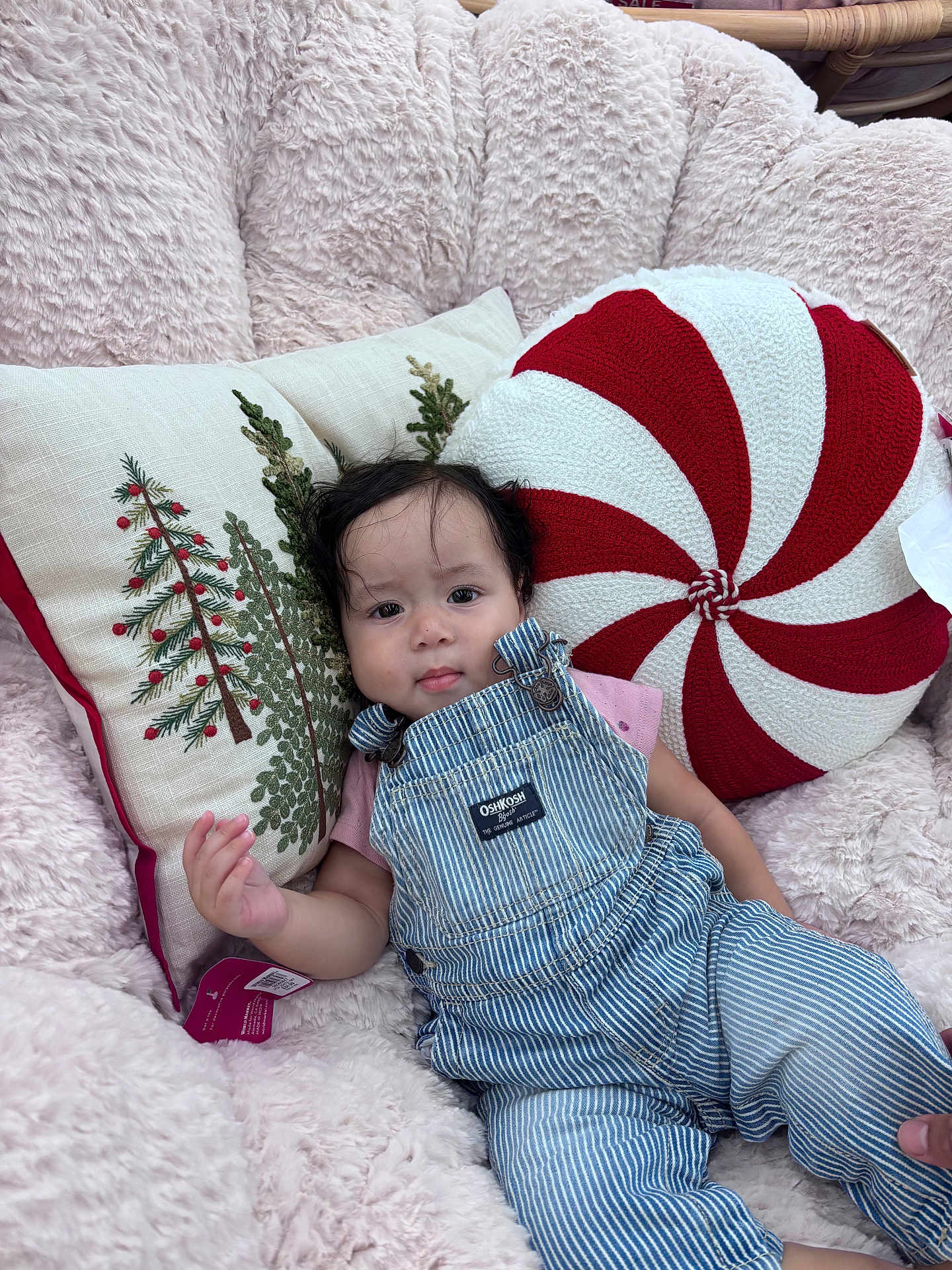 Liliana joined the competition — help win amazing prizes! baby, child, infant, overalls, striped_clothing, pink_shirt, fluffy_chair, pillows, christmas_pillow, peppermint_pillow, embroidered_pillow, indoor, cute, relaxed, portrait, person, soft_texture, holiday_theme, seated, young