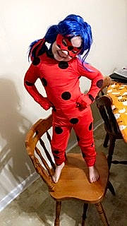 Annalisa is registered to the contest to win money with this photo: abdomen, action_figure, chest, cool, costume, fiction, fictional_character, figurine, flesh, furniture, joint, joy, knee, machine, person, red, sitting, toy, trunk, wig