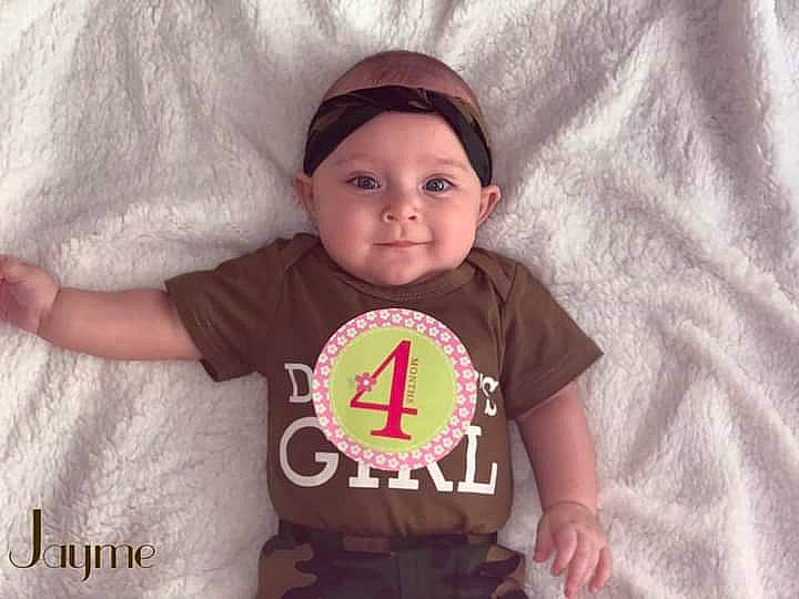 Jayme is registered to the contest to win money with this photo: baby, baby_toddler_clothing, child, cool, happy, head, headgear, headwear, joy, person, pink, product, sleeve, smile, t_shirt, toddler, top