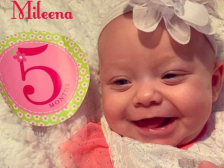 Mileena is registered to the contest to win money with this photo: baby, baby_toddler_clothing, beauty, cheek, child, face, facial_expression, hair_accessory, happy, head, headgear, headwear, joy, lip, nose, person, photography, pink, product, skin