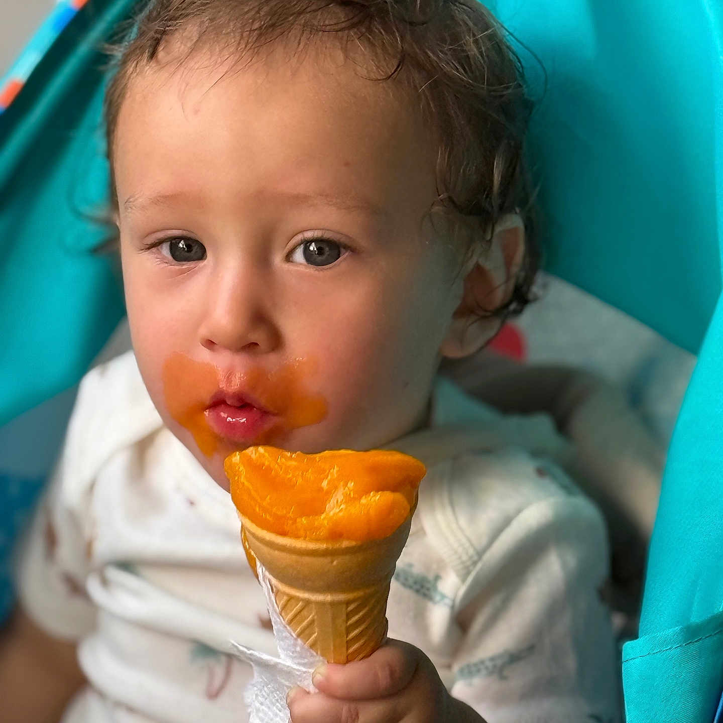 Alfredo joined the competition — help win amazing prizes! baby, child, clothing, cute, delicious, face, food, hand, happy, holding, ice_cream, messy, orange, outdoor, portrait, snack, stroller, summer, sweet, toddler