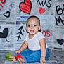Kai joined the competition — help win amazing prizes! baby, child, smiling, jeans, white_shirt, rose, newspaper, heart, drawing, graffiti, floor, sitting, cute, happy, indoors, portrait, infant, playful, background, colorful