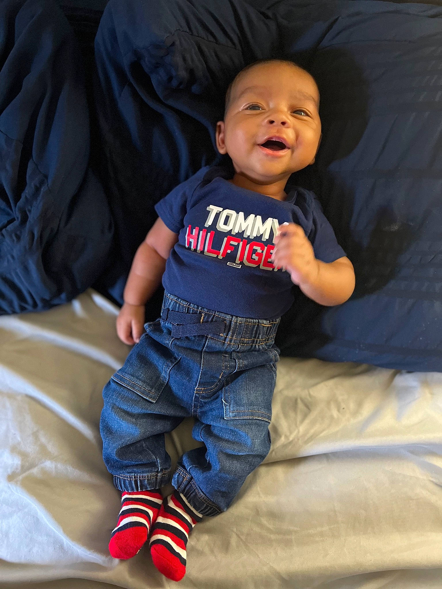 Jamir joined the competition — help win amazing prizes! arm, baby, baby_toddler_clothing, child, comfort, couch, elbow, electric_blue, eye, flash_photography, fun, happy, linens, pattern, person, play, sitting, sleeve, smile, t_shirt