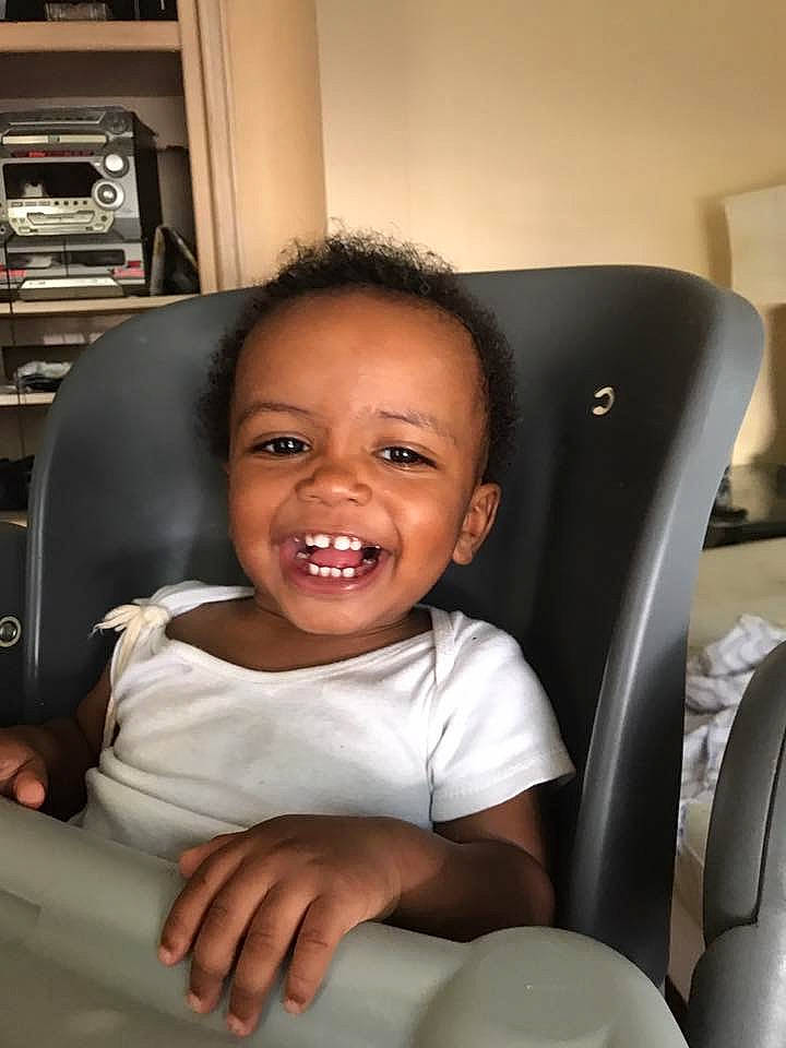 Kyrin is registered to the contest to win money with this photo: baby, car_seat, cheek, child, chin, comfort, face, facial_expression, head, joy, laugh, mouth, person, sitting, skin, smile, toddler, tooth