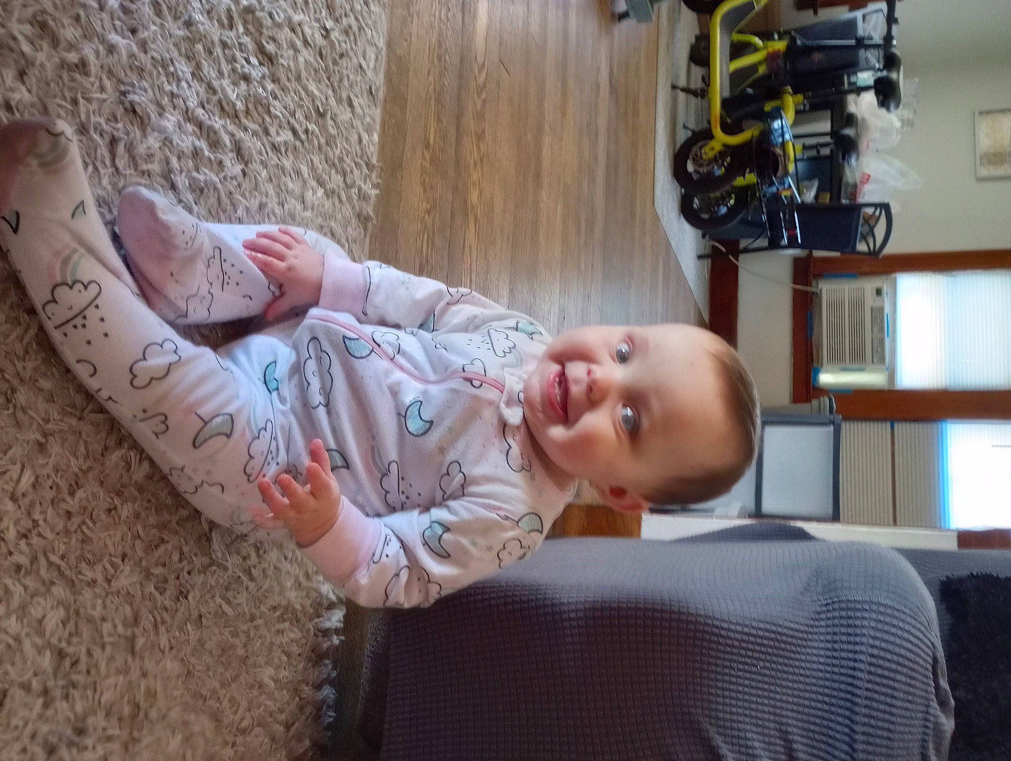 Lainie is registered to the contest to win money with this photo: baby, baby_toddler_clothing, child, comfort, elbow, finger, flooring, human_body, human_leg, joint, joy, leg, person, shelf, skin, smile, thigh, tire, toddler, tree
