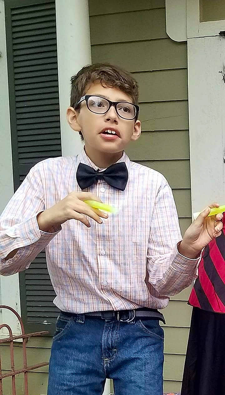 Aiden is registered to the contest to win money with this photo: dress_shirt, eyewear, glasses, person, shirt, smile, top, vision_care