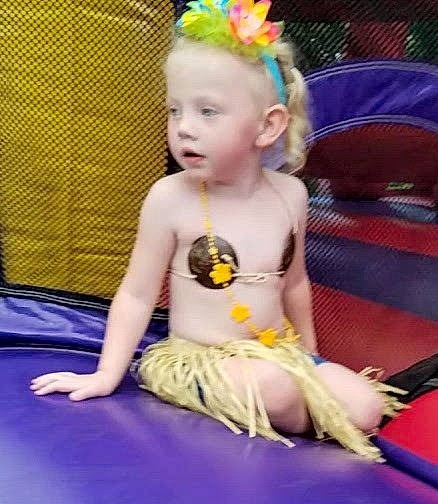 Aria is registered to the contest to win money with this photo: baby, baby_toys, child, costume, fun, hair_accessory, person, play, sitting, smile, toddler, yellow