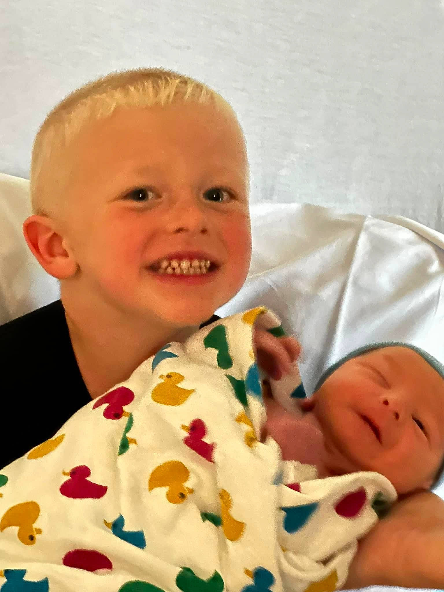 Carter is registered to the contest to win money with this photo: baby, baby_products, baby_sleeping, baby_toddler_clothing, cheek, child, comfort, event, happy, joy, linens, nose, pattern, person, room, skin, sleeve, smile, t_shirt, textile