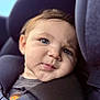 toddler, child, portrait, car_seat, baby, seat_belt, blue_eyes, face, expression, cushion, clothing, infant, straps, car_interior, cute, close_up, young_child, sitting, head, skin