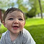 baby, child, smiling, blue_eyes, short_hair, gray_shirt, outdoor, green_background, grass, happy, closeup, portrait, cute, infant, young_child, toddler, sunlight, nature, person, face