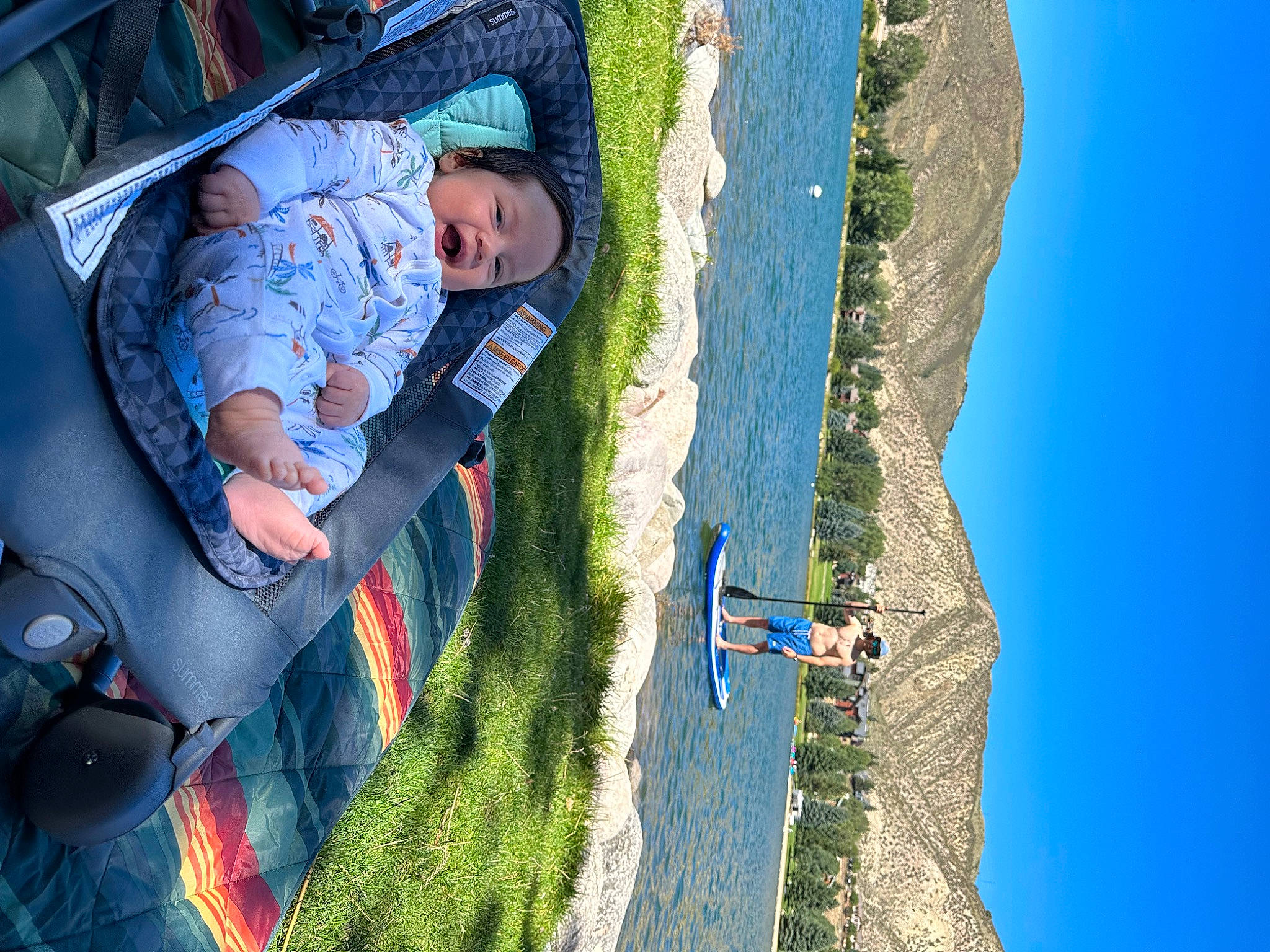 Alek is registered to the contest to win money with this photo: adventure, air_sports, extreme_sport, fun, grass, headwear, landscape, leisure, outdoor_recreation, parachute, parachuting, paragliding, people_in_nature, person, plant, recreation, sky, slope, sport_climbing, toddler