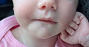 Kayleigh is registered to the contest to win money with this photo: baby, calm, child, close_up, cute, eyelids_closed, face, hand, head, human, indoors, infant, peaceful, pink_shirt, portrait, resting, skin, sleeping, soft_light, young