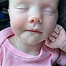 Kayleigh is registered to the contest to win money with this photo: baby, sleeping, pink_shirt, close_up, face, hand, peaceful, infant, child, portrait, skin, head, eyelids_closed, soft_light, resting, cute, young, indoors, human, calm