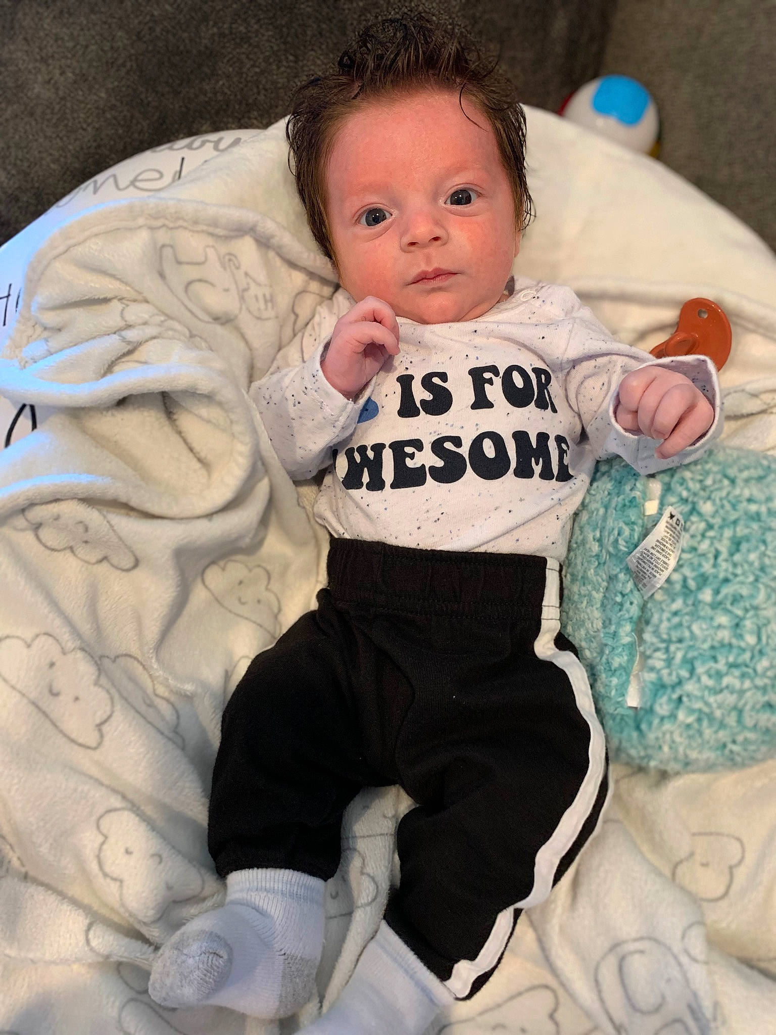 Levi joined the competition — help win amazing prizes! arm, baby, baby_carriage, baby_products, baby_toddler_clothing, cheek, child, comfort, eye, face, happy, head, iris, leg, linens, person, sitting, skin, sleeve, t_shirt