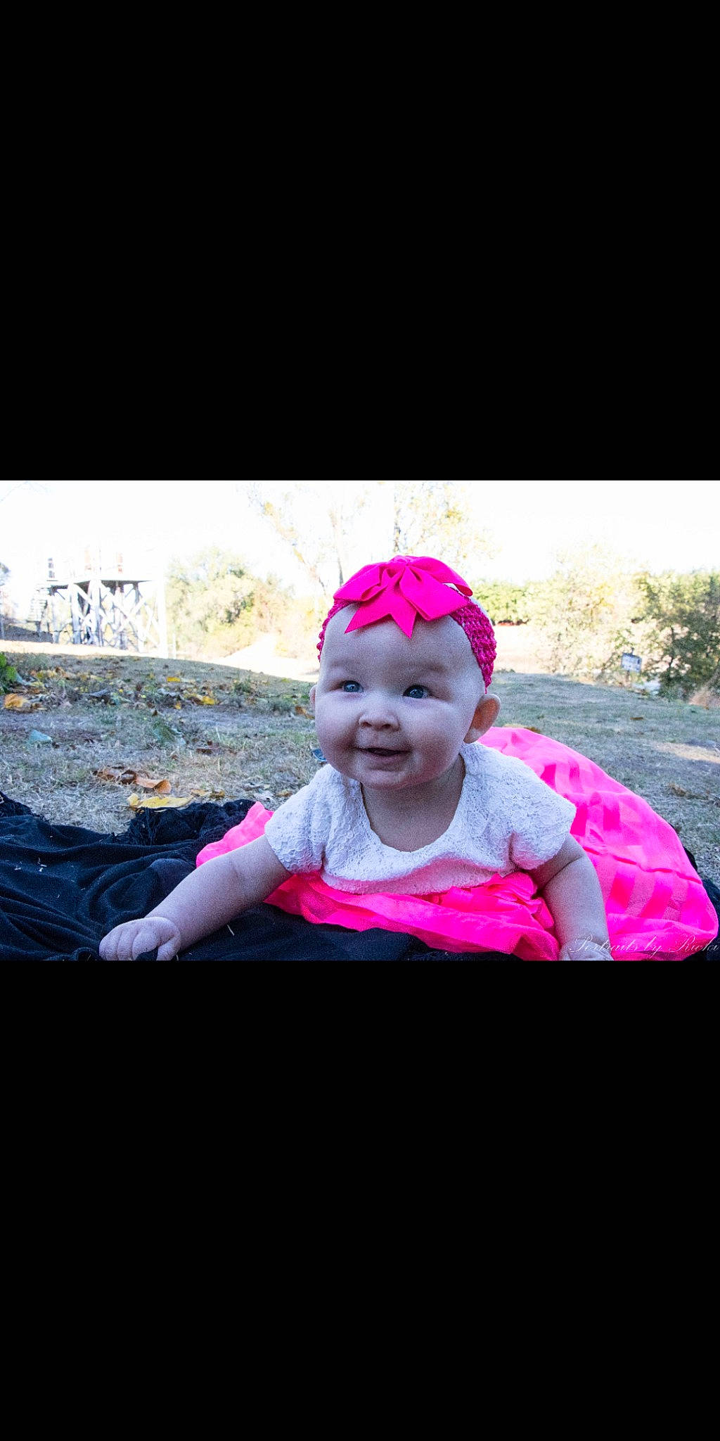 Lillie is registered to the contest to win money with this photo: baby, cheek, child, fun, grass, hair_accessory, happy, headband, headgear, magenta, person, photograph, photography, pink, plant, play, sitting, smile, snapshot, toddler