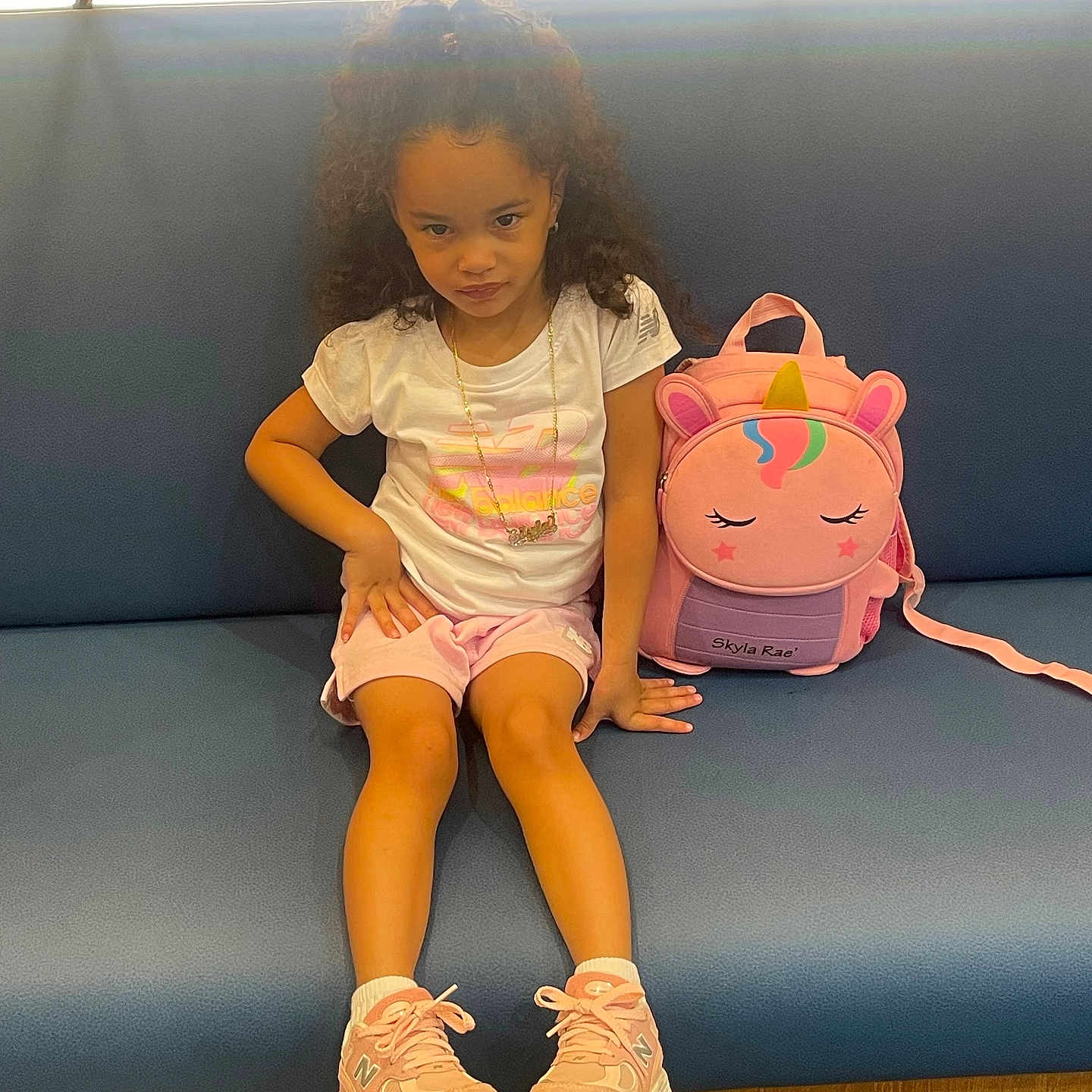 Skyla joined the competition — help win amazing prizes! accessories, child, clothing, curlyhair, face, female, footwear, girl, hair, head, jewelry, necklace, person, shoe, shorts, sitting, sleeve