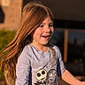 Adalyn is registered to the contest to win money with this photo: child, girl, smiling, long_hair, outdoor, sunlight, shirt, cartoon, happy, face, portrait, casual_clothing, daylight, expression, person, young, motion, playful, nature, fun