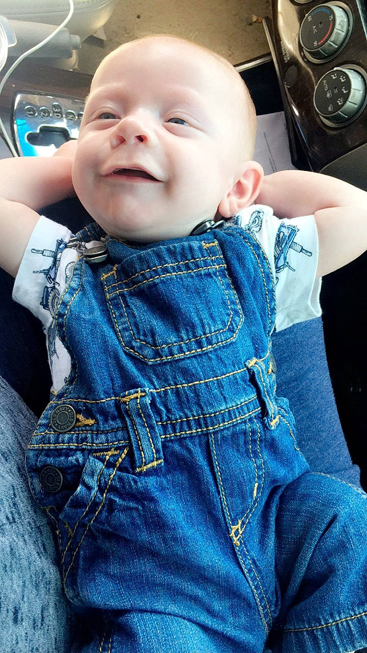 Loghan is registered to the contest to win money with this photo: baby, blue, cheek, child, cool, denim, jeans, overall, person, skin, smile, textile, toddler