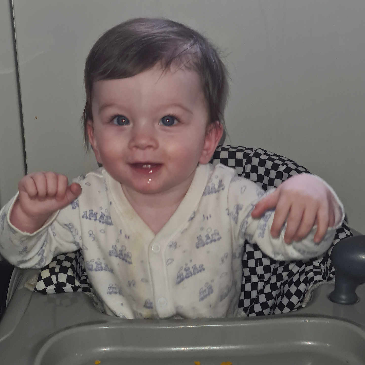 Bear is registered to the contest to win money with this photo: baby, bodypart, closet, cupboard, cutlery, eating, face, finger, food, hand, happy, head, mouth, person, photography, portrait, sink, smile, spoon, teeth